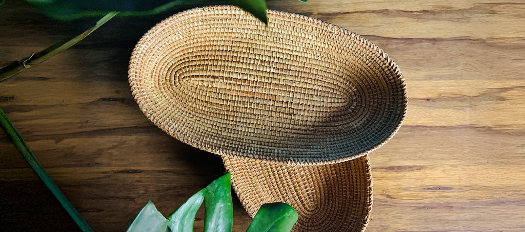 Handwoven oval baskets on a wooden table